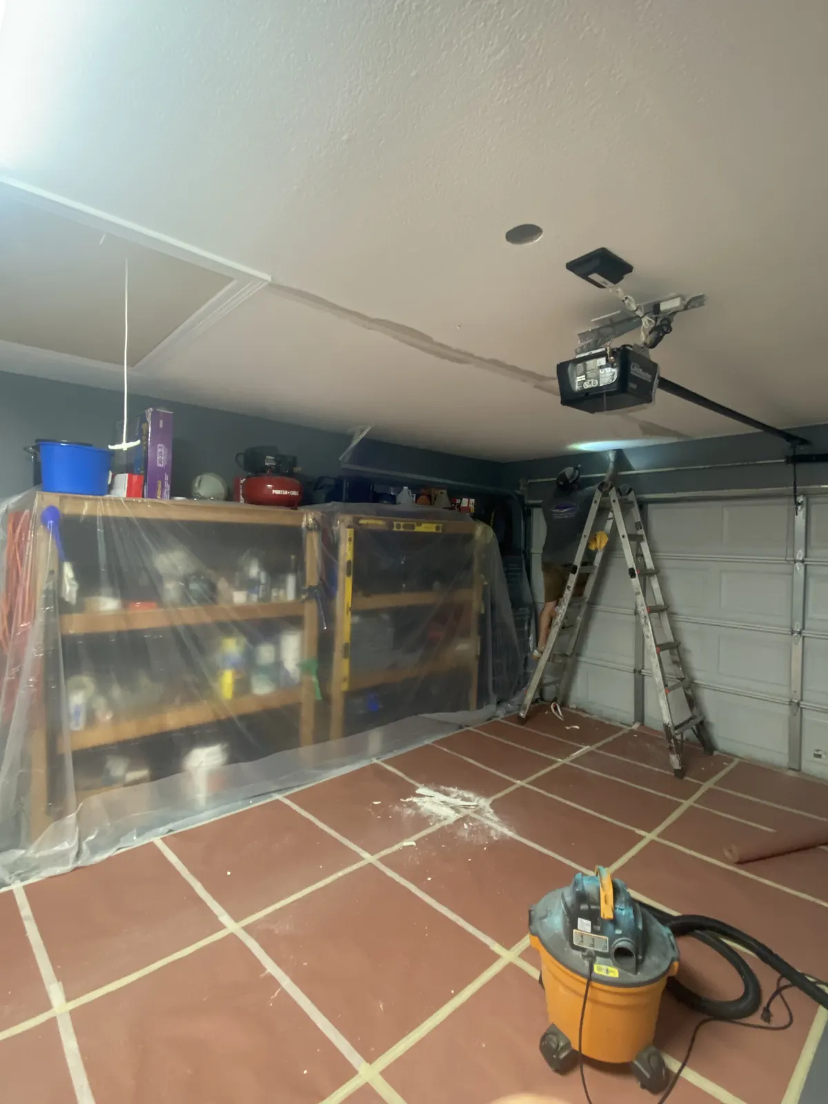 Masco Pros repairing and taping drywall ceiling seams in a McKinney, TX garage