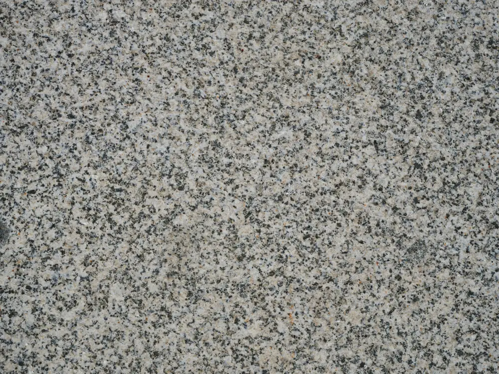 Gray and tan speckled flake texture like a decorative epoxy floor finish