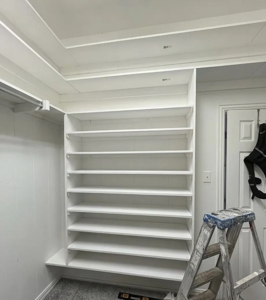 Painted closet built-in shelving in bright white in a McKinney, TX home