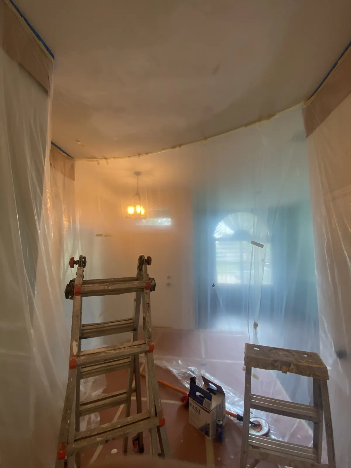 Entryway masked off during a drywall ceiling repair and retexture in McKinney, TX