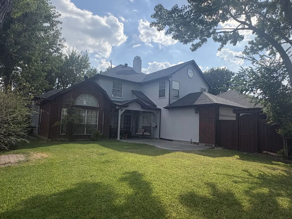 Two-story brick and painted siding home exterior in McKinney, TX
